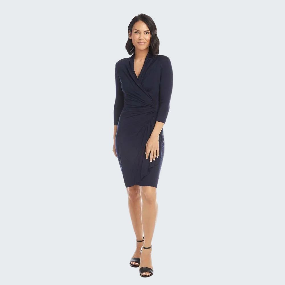 Woman wearing a navy blue dress on a white background