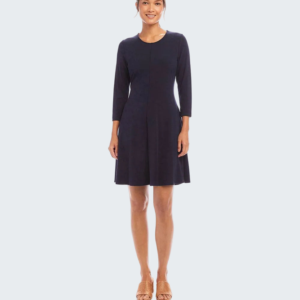 A woman modeling a dark navy blue knee-length dress with three-quarter sleeves and a round neckline, standing against a plain white studio background.