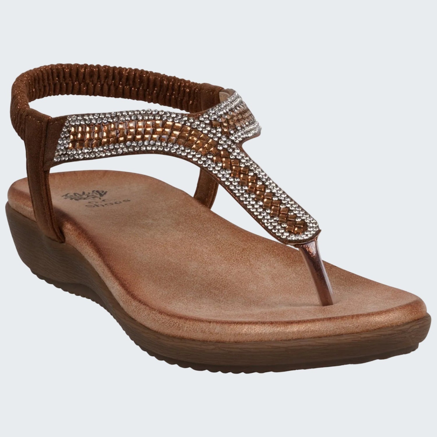 Brown sandal with rhinestone embellishments on a white background