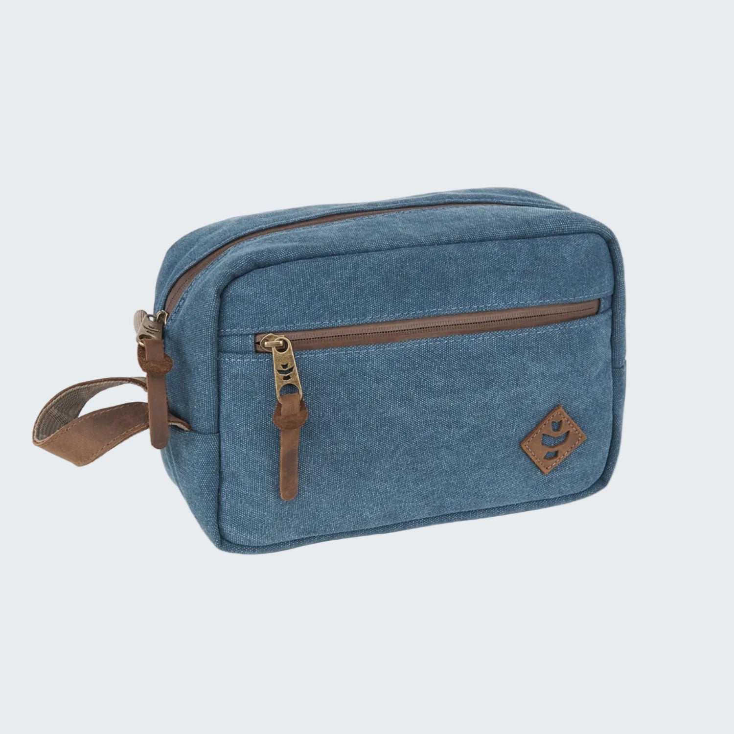 Blue toiletry bag with brown zippers and strap on a white background