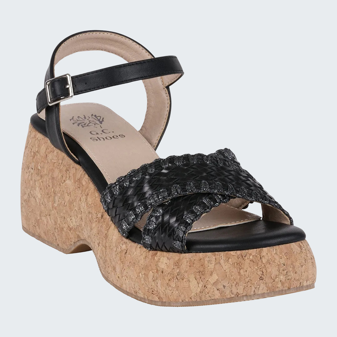 Black wedge sandal with cork sole on a white background