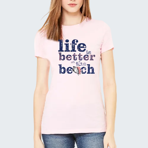 Person wearing a pink t-shirt with 'Life is better at the beach' text and sailboat graphic.