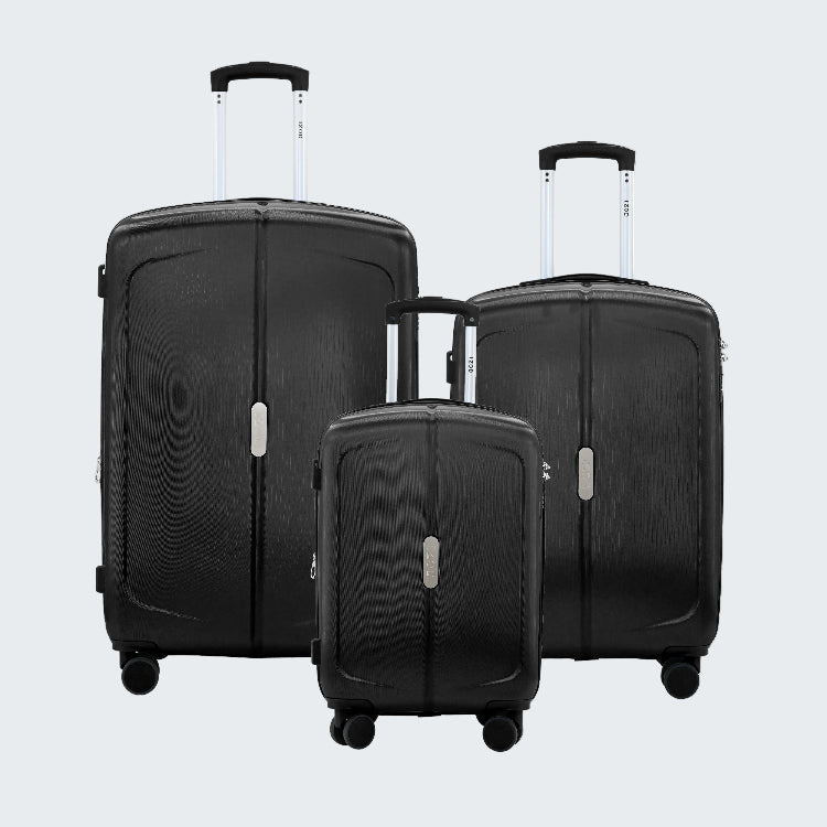 Set of three black suitcases of different sizes on a white background