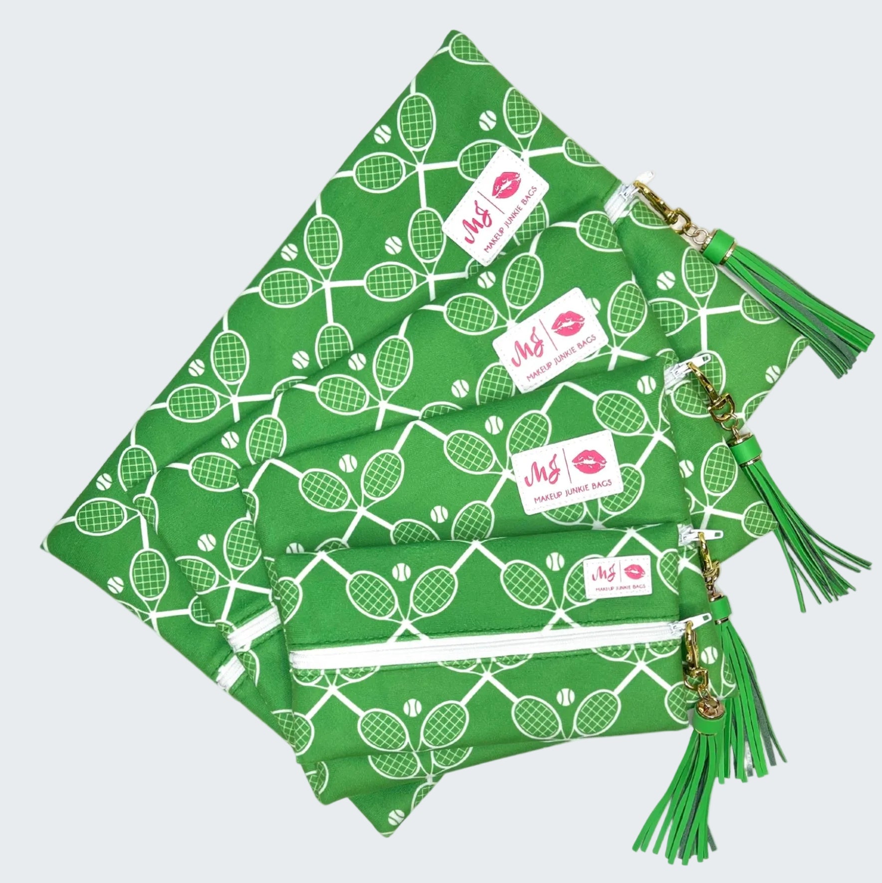 Green bags with tennis racket pattern and tassels on a white background