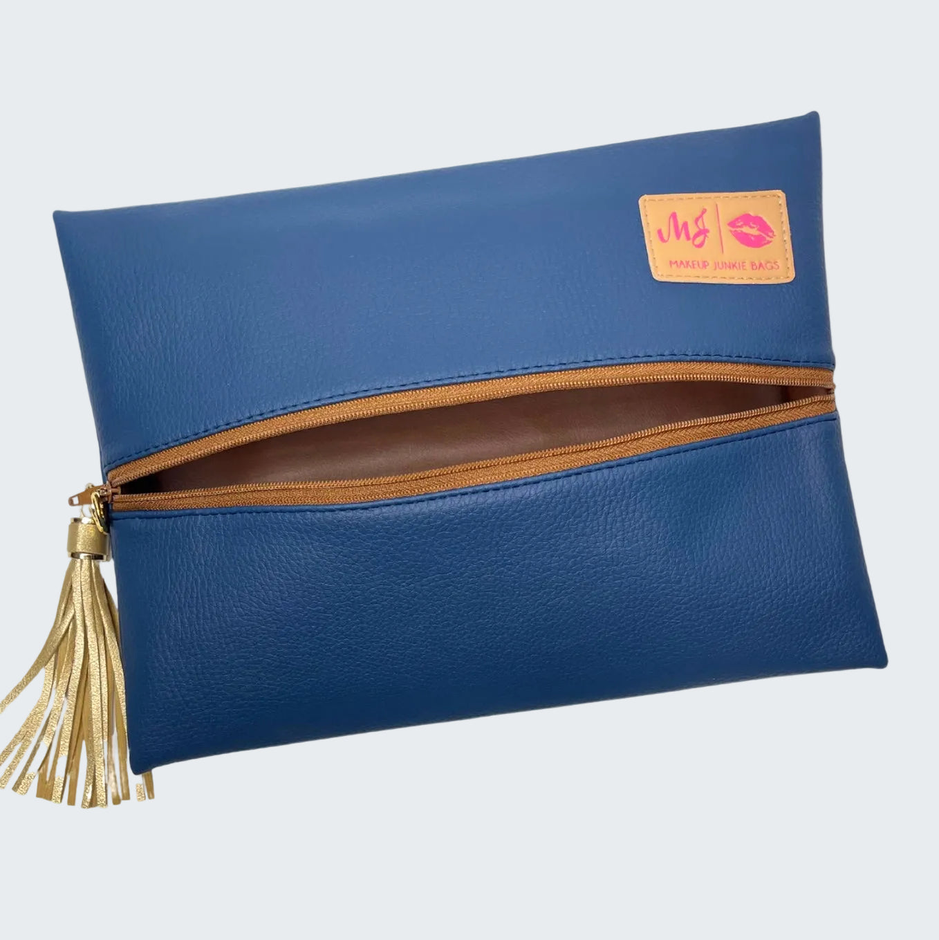 Blue clutch bag with gold tassel and visible brand logo on a white background