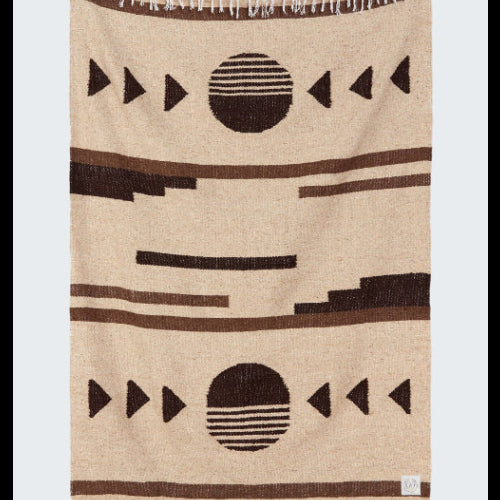 Beige blanket with black geometric patterns on a white background