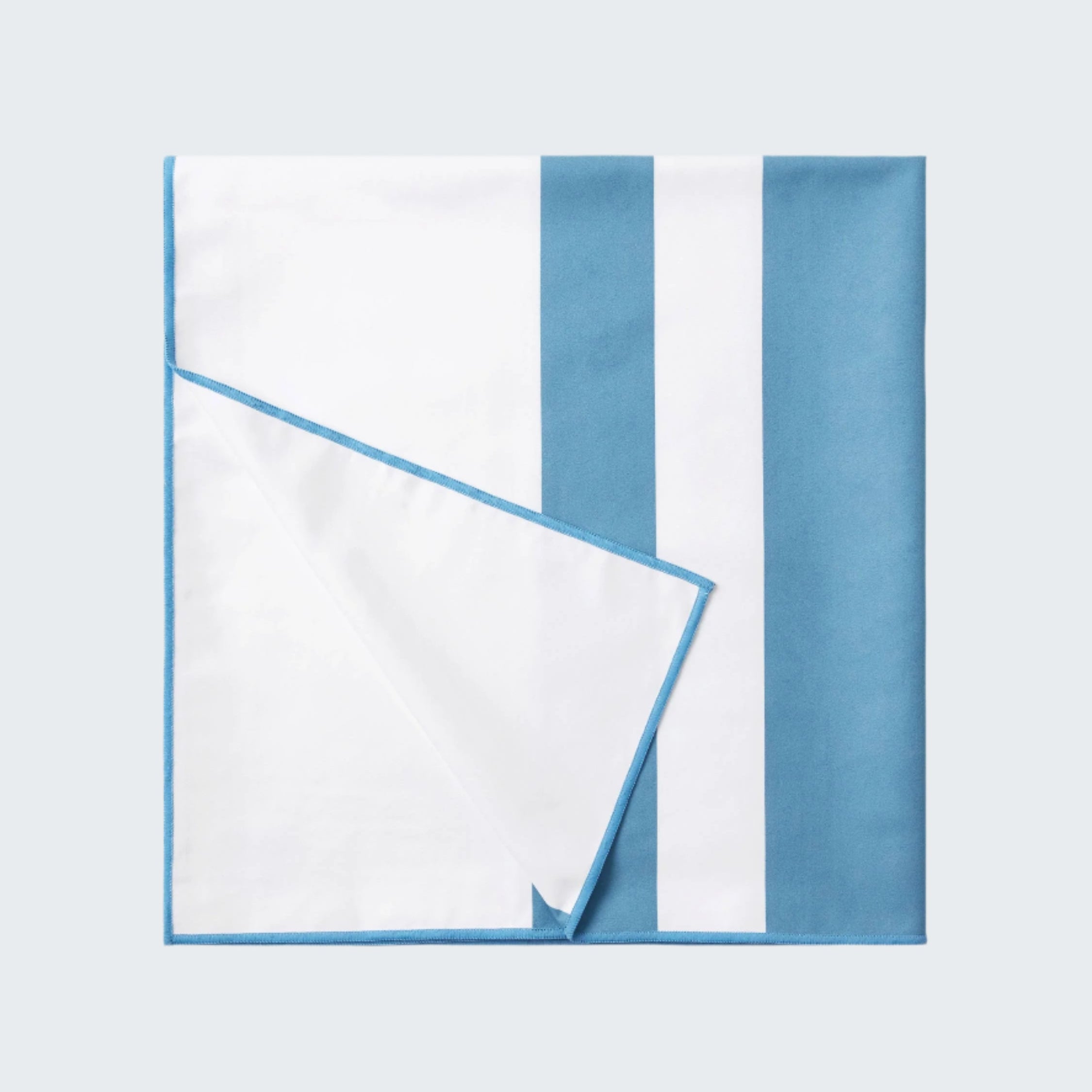 White napkin with blue stripes on a white background