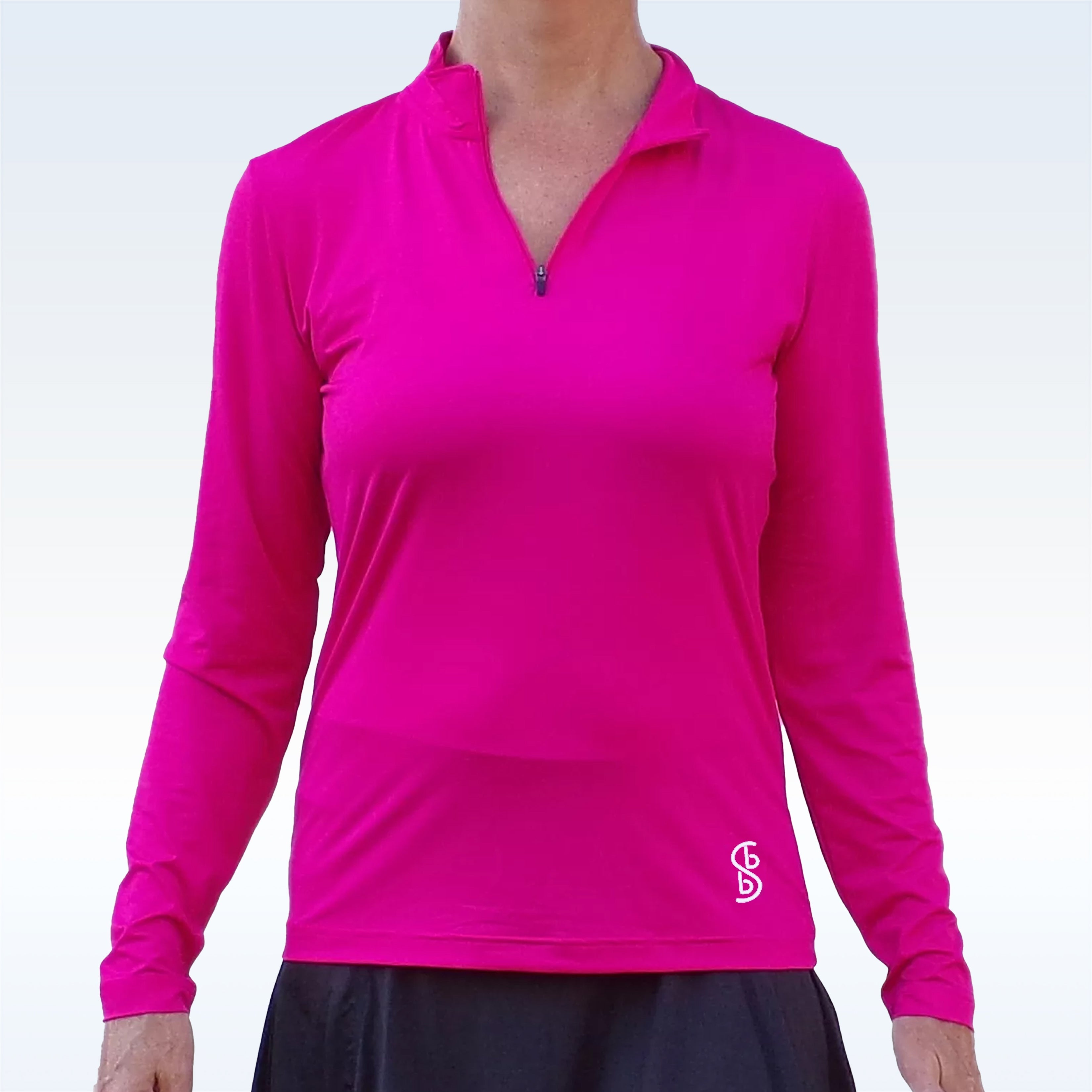 Person wearing a bright pink long-sleeve shirt with a logo on a white background