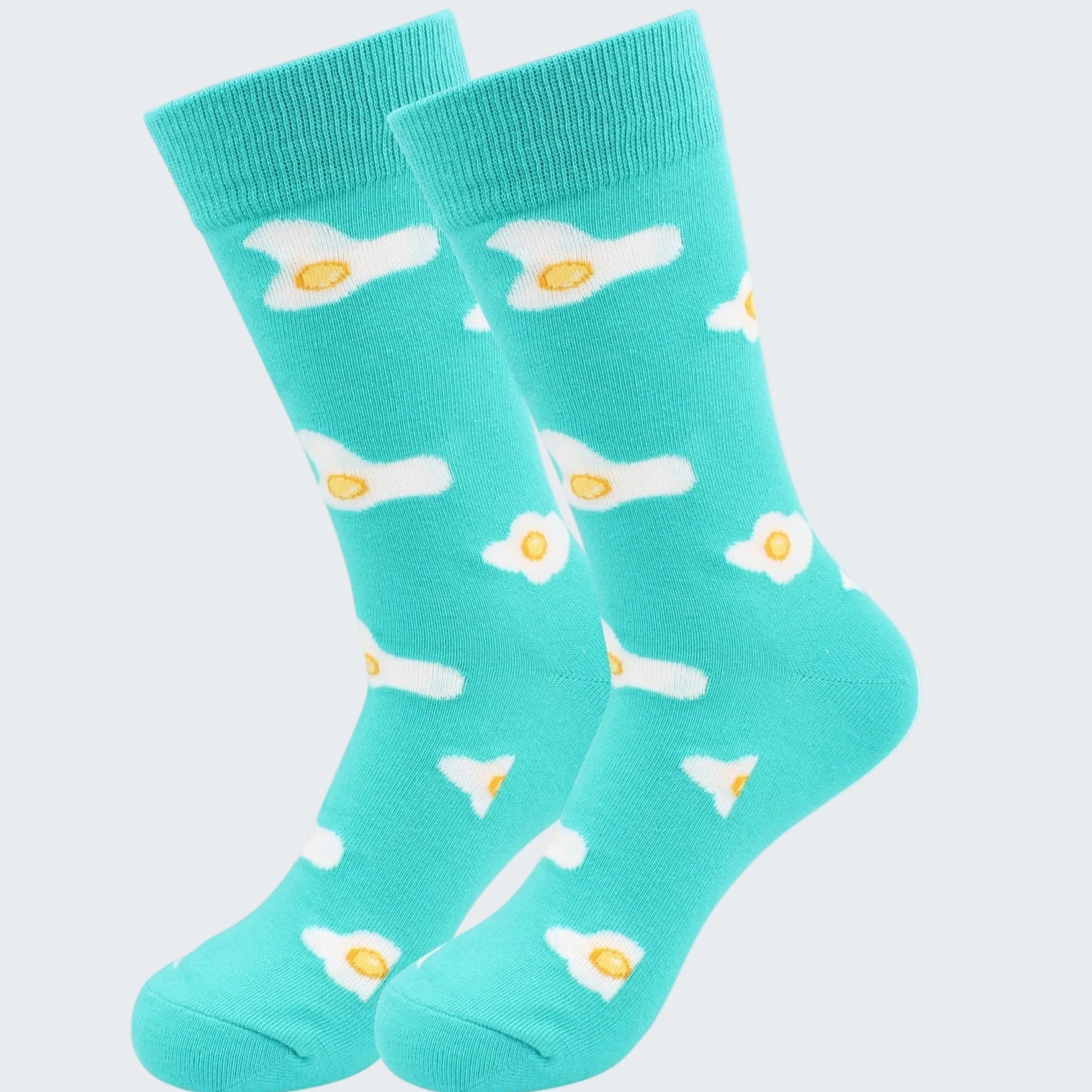 Turquoise socks with fried egg design on a white background