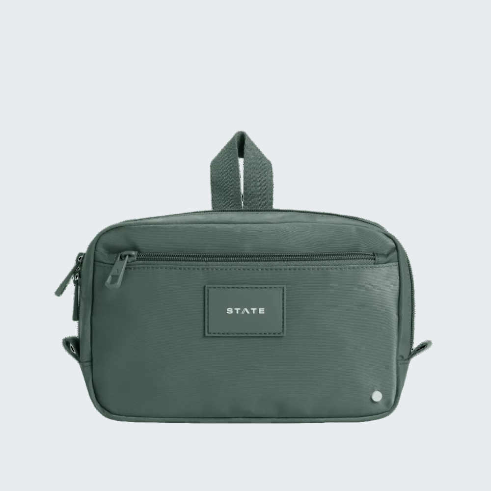 Green travel bag with 'STATE' label on a white background