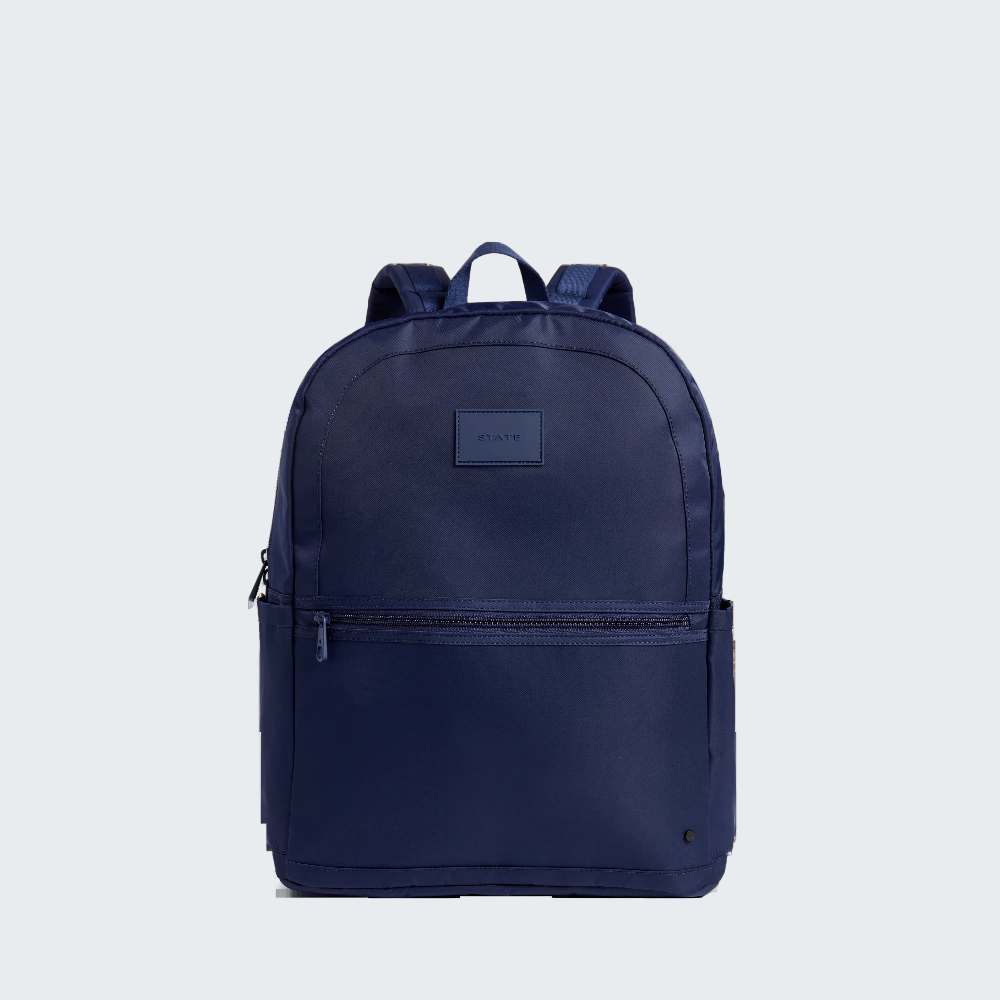 Navy blue backpack with a visible brand logo on a white background