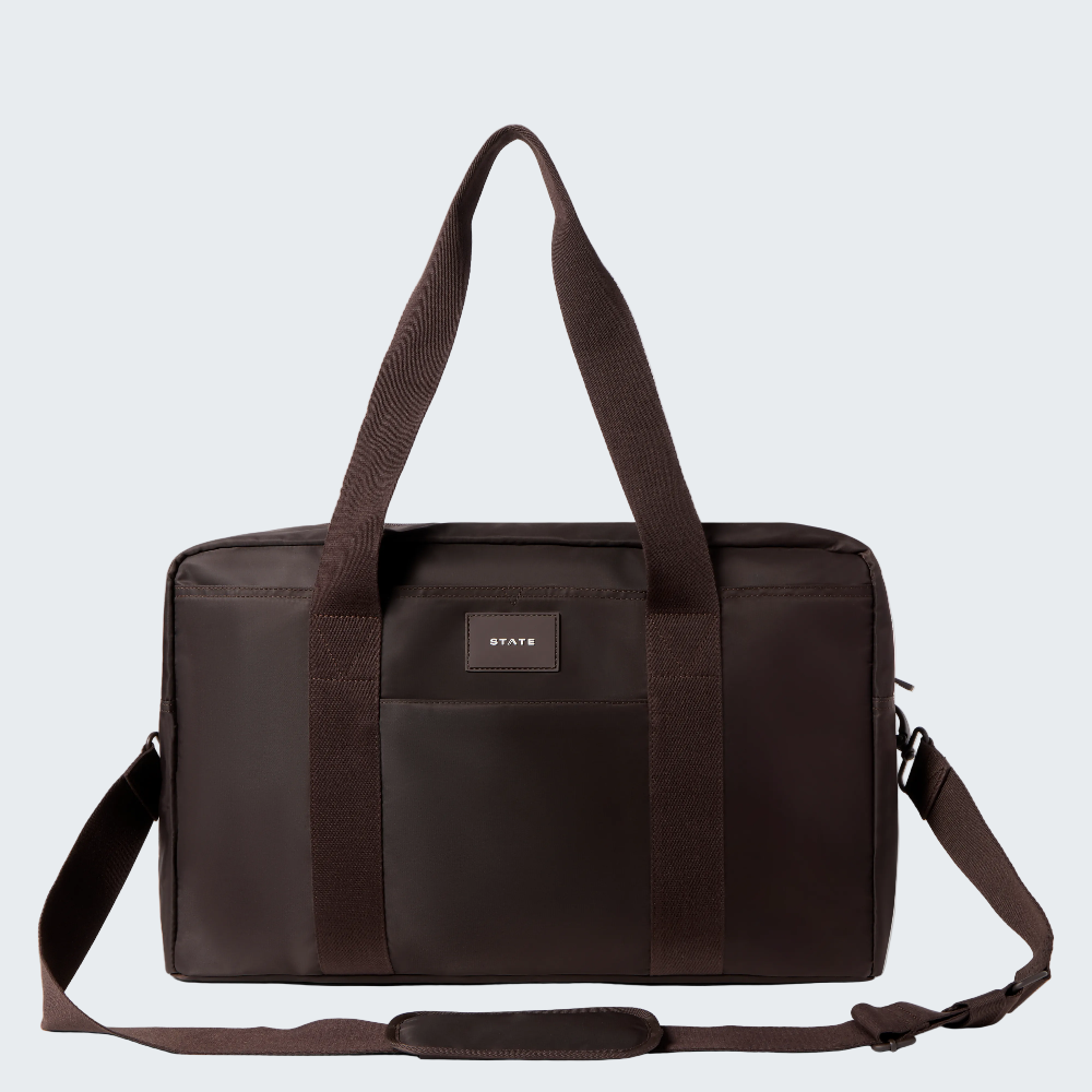 Brown duffel bag with a visible brand logo on a white background