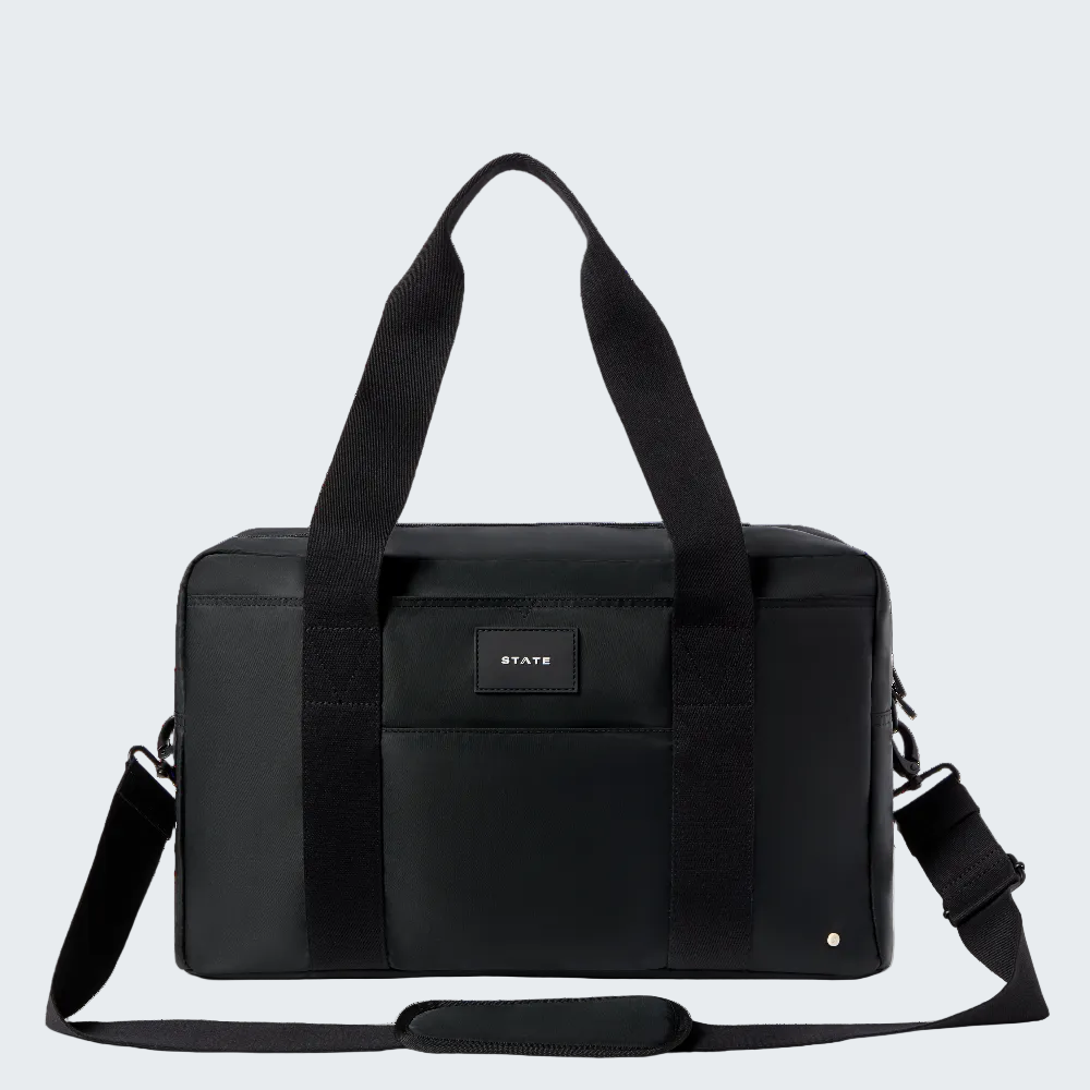 Black duffel bag with shoulder strap on a white background