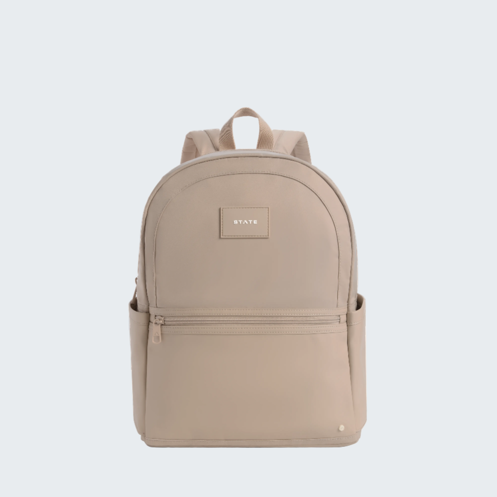 Beige backpack with a visible brand logo on a white background
