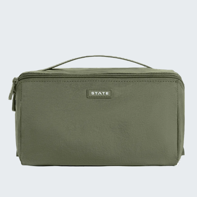 An olive green rectangular zippered pouch with a top handle and a small silver 'STATE' logo plaque on the front, set against a plain white background.