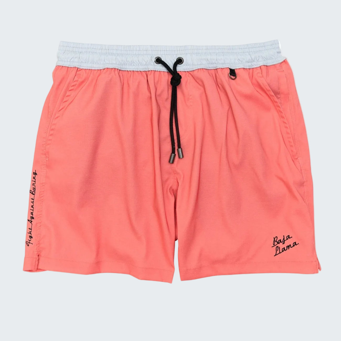 Coral pink athletic shorts with a light gray elastic waistband, black drawstring, and small black script logos on the sides, shown against a plain white background.