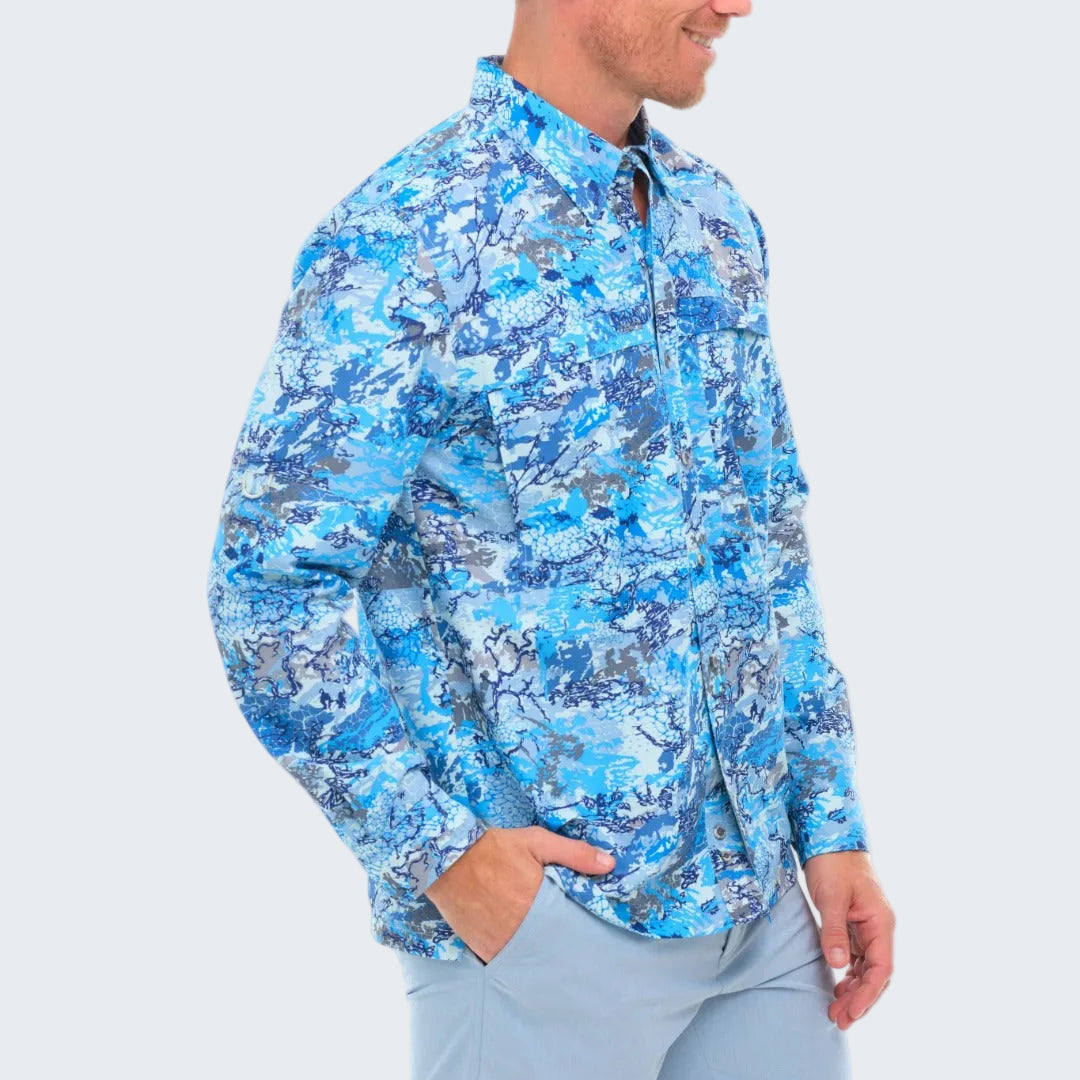 Person wearing a blue camouflage shirt on a white background