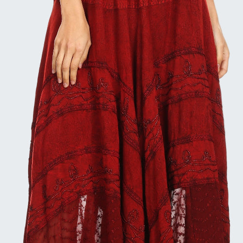 Red patterned skirt worn by a person on a white background