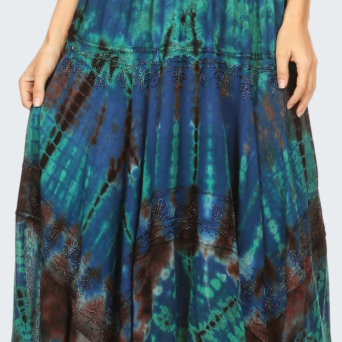 Tie-dye skirt with blue, green, and brown patterns on a white background