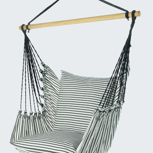 Striped hammock chair with wooden rod on a white background