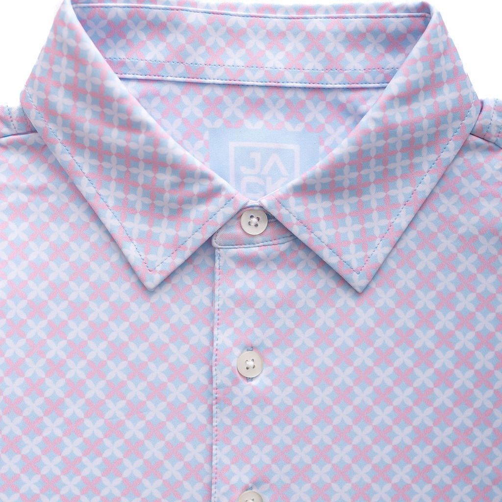 Close-up of a light blue and pink checkered polo shirt with buttons.