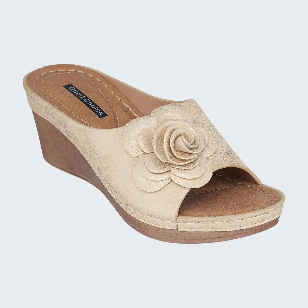 Beige wedge sandal with a rose detail on a white background