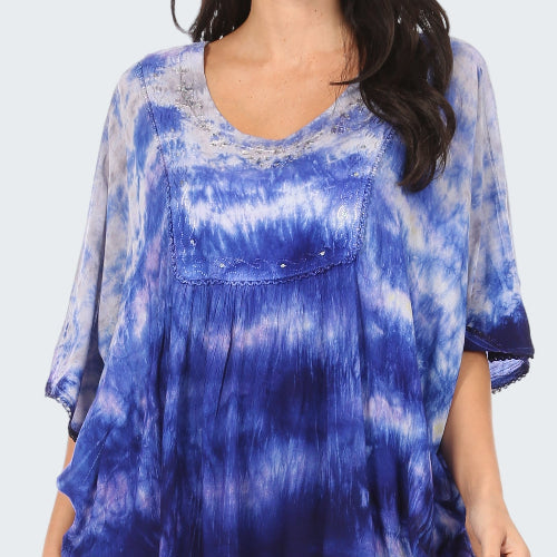 Blue tie-dye shirt worn by a person on a white background