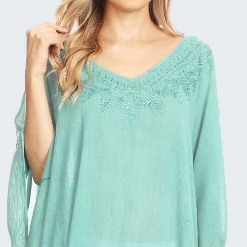 Mint green lace top worn by a model on a white background