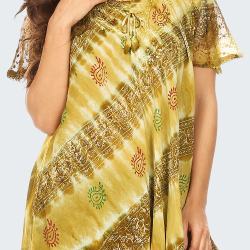 Woman wearing a yellow tie-dye top with intricate patterns on a white background