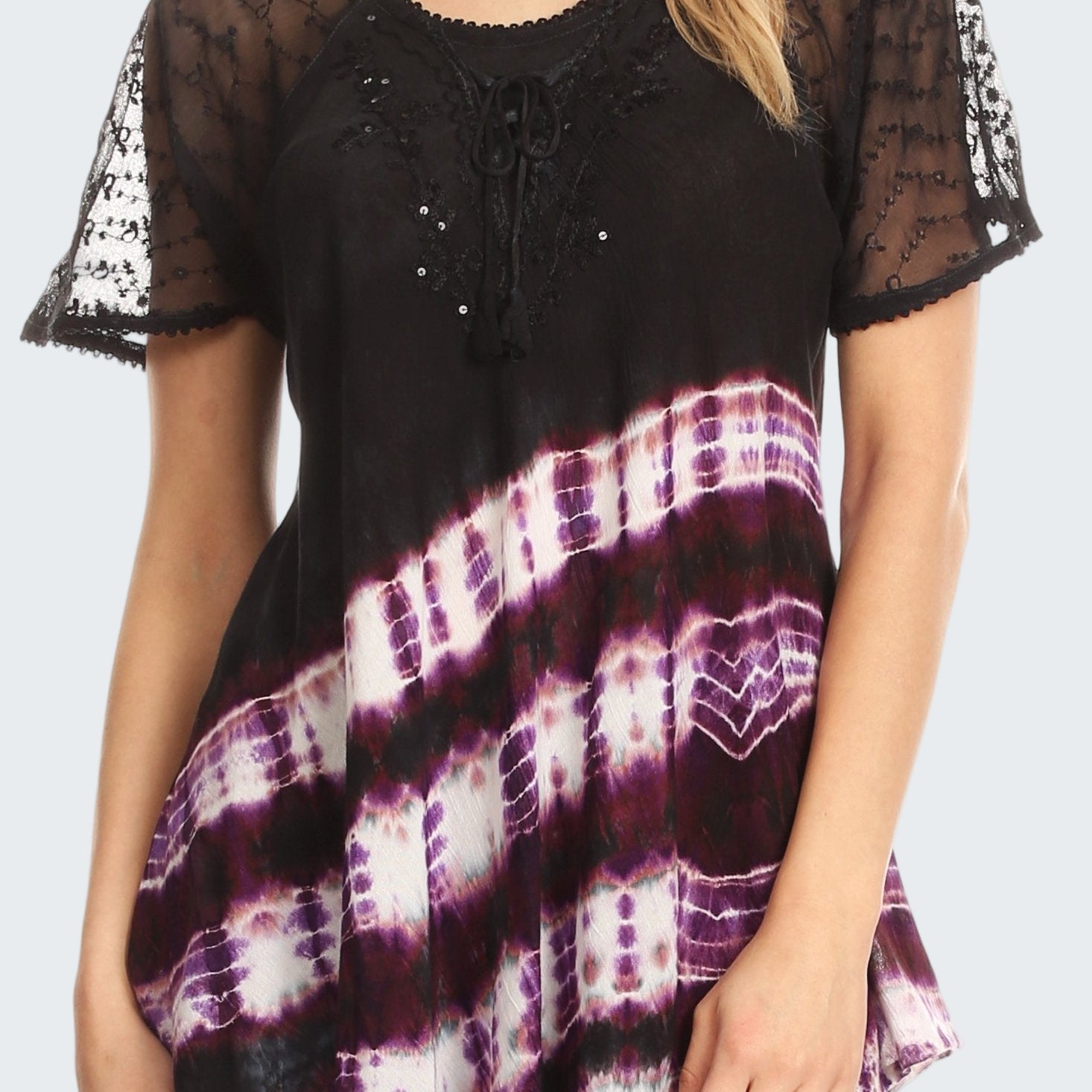 Black lace top with tie-dye pattern worn by a model