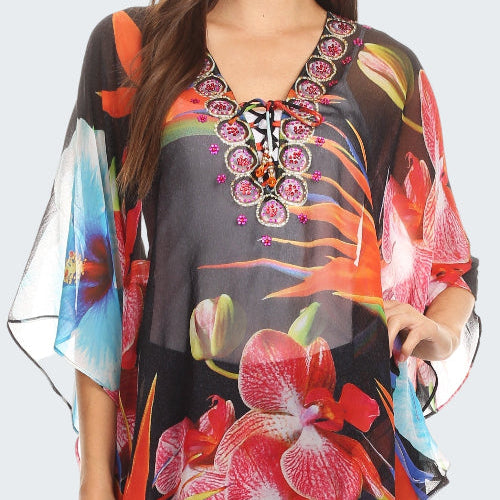 Colorful floral kimono-style top with embroidery on a white background
