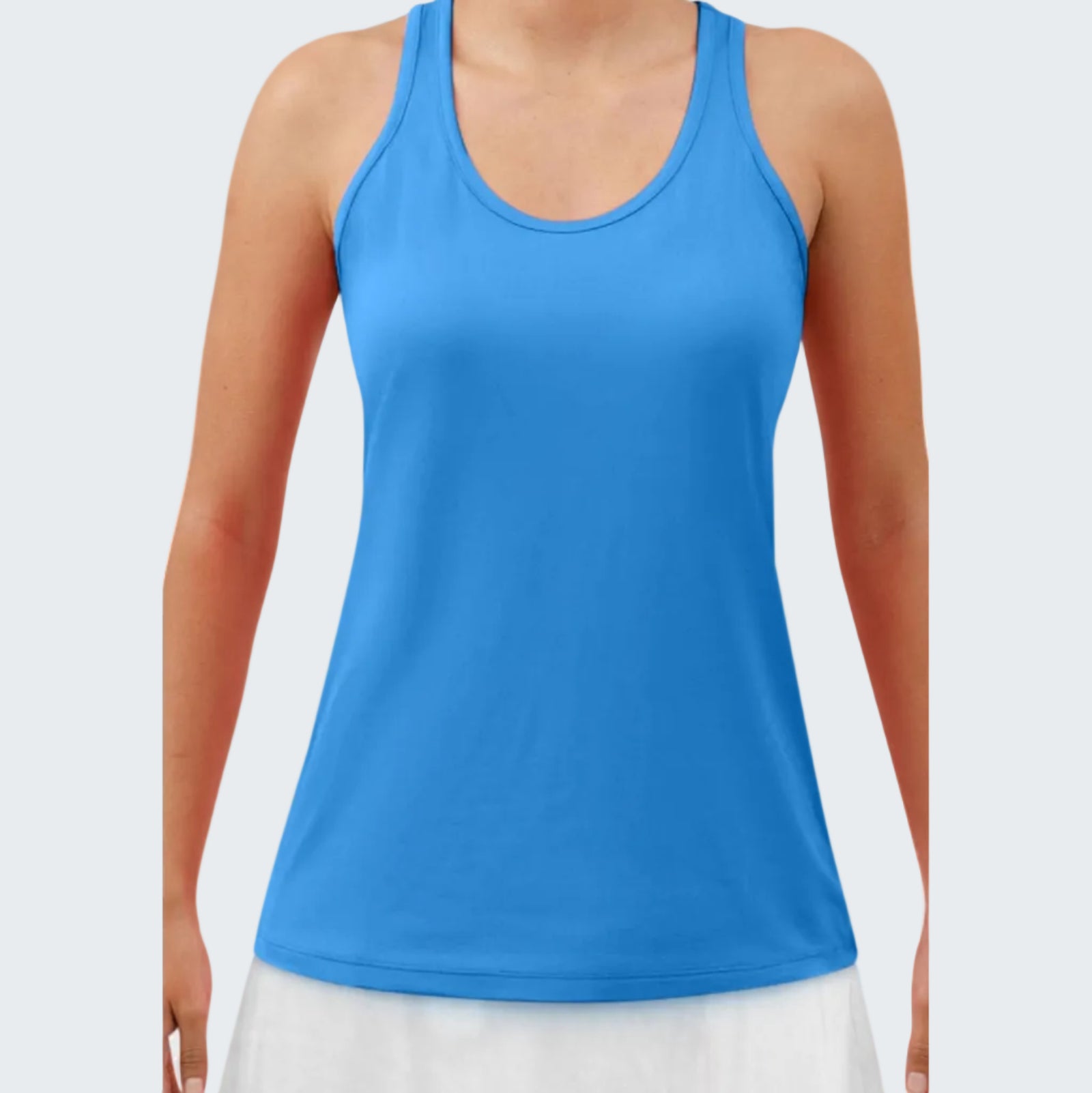 Blue tank top worn by a person on a white background
