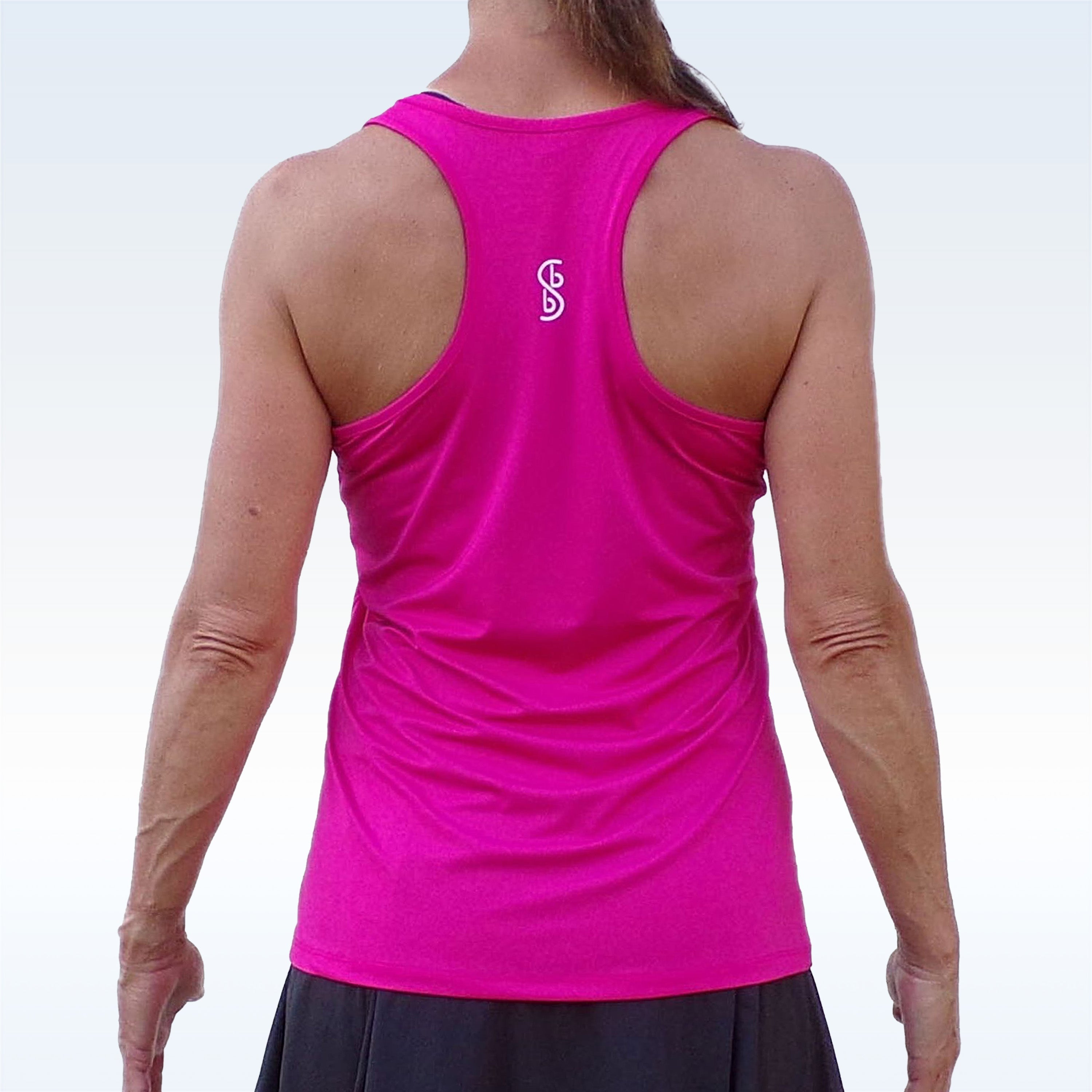 Person wearing a bright pink tank top with a logo on the back against a white background