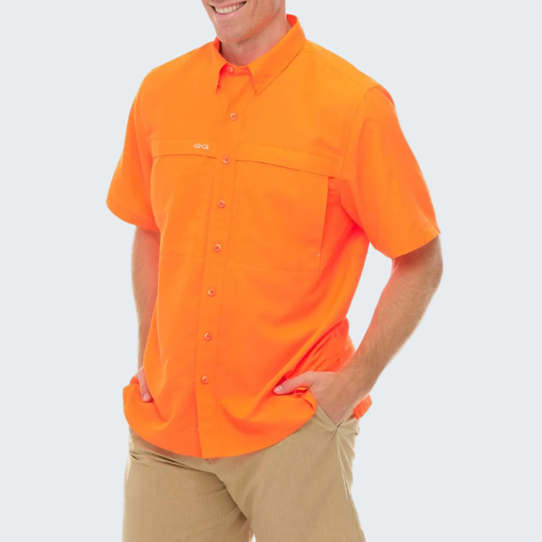 Person wearing a bright orange short-sleeve shirt on a white background