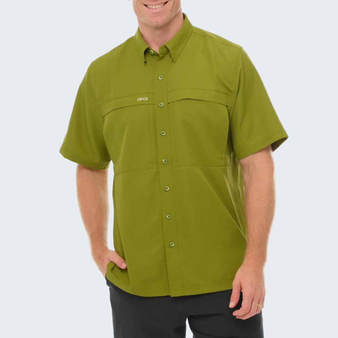 Man wearing a green short-sleeve shirt on a white background