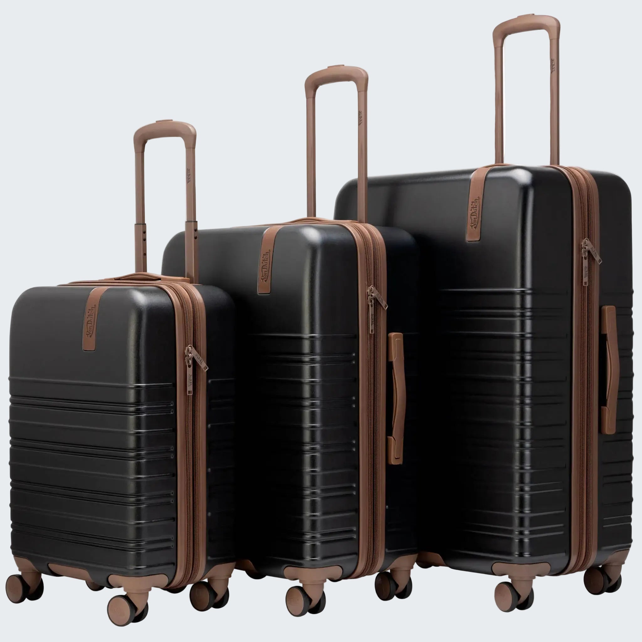 Set of black suitcases with brown handles and wheels on a white background