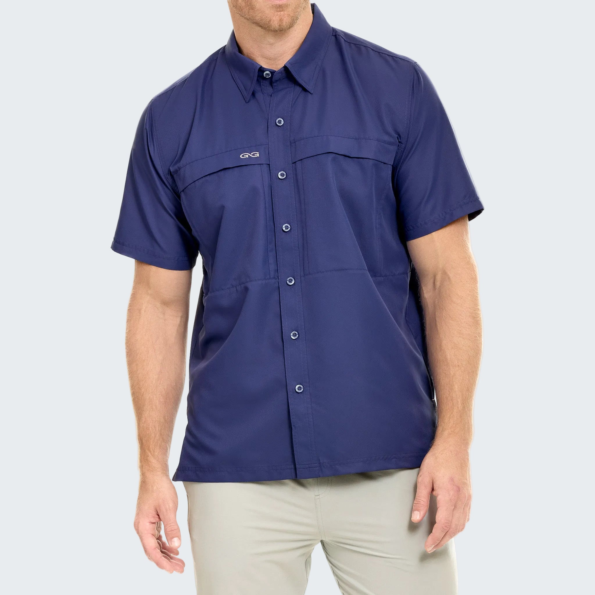 Man wearing a blue short-sleeve shirt on a white background
