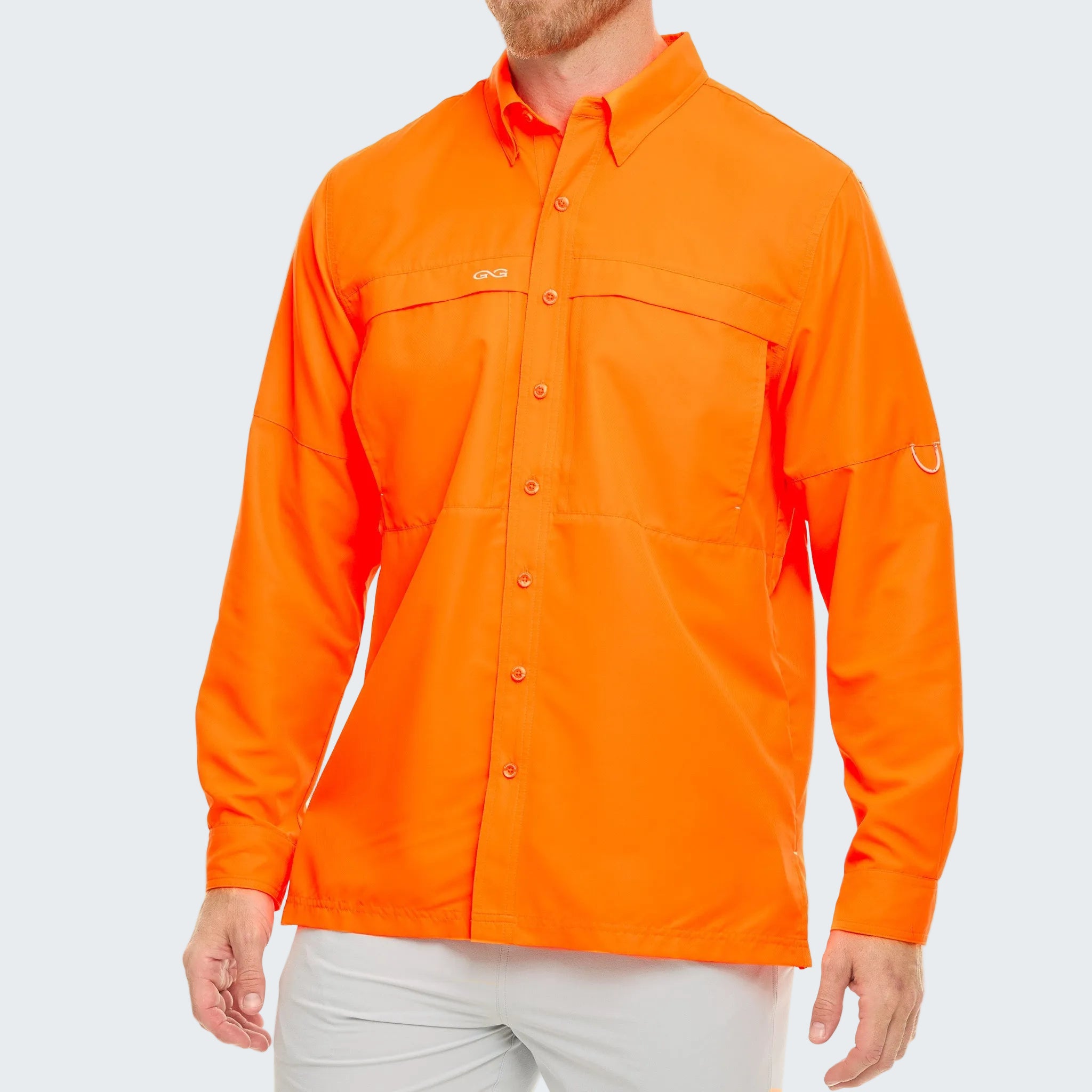 Orange long-sleeve shirt worn by a person on a white background