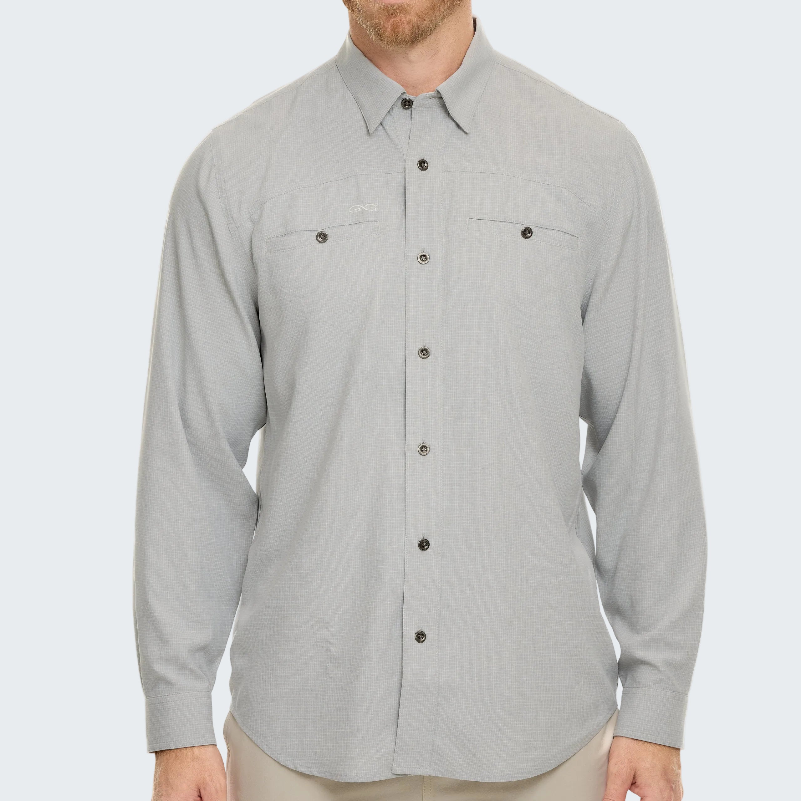 Man wearing a light gray button-up shirt on a white background