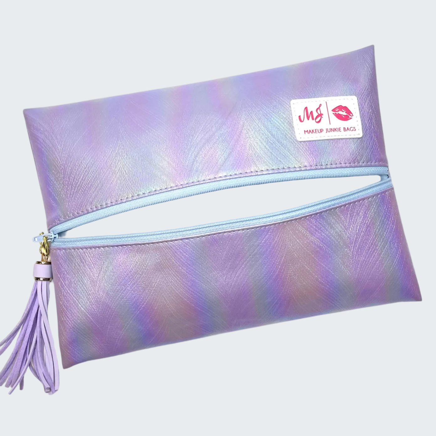 Iridescent makeup bag with a tassel on a white background