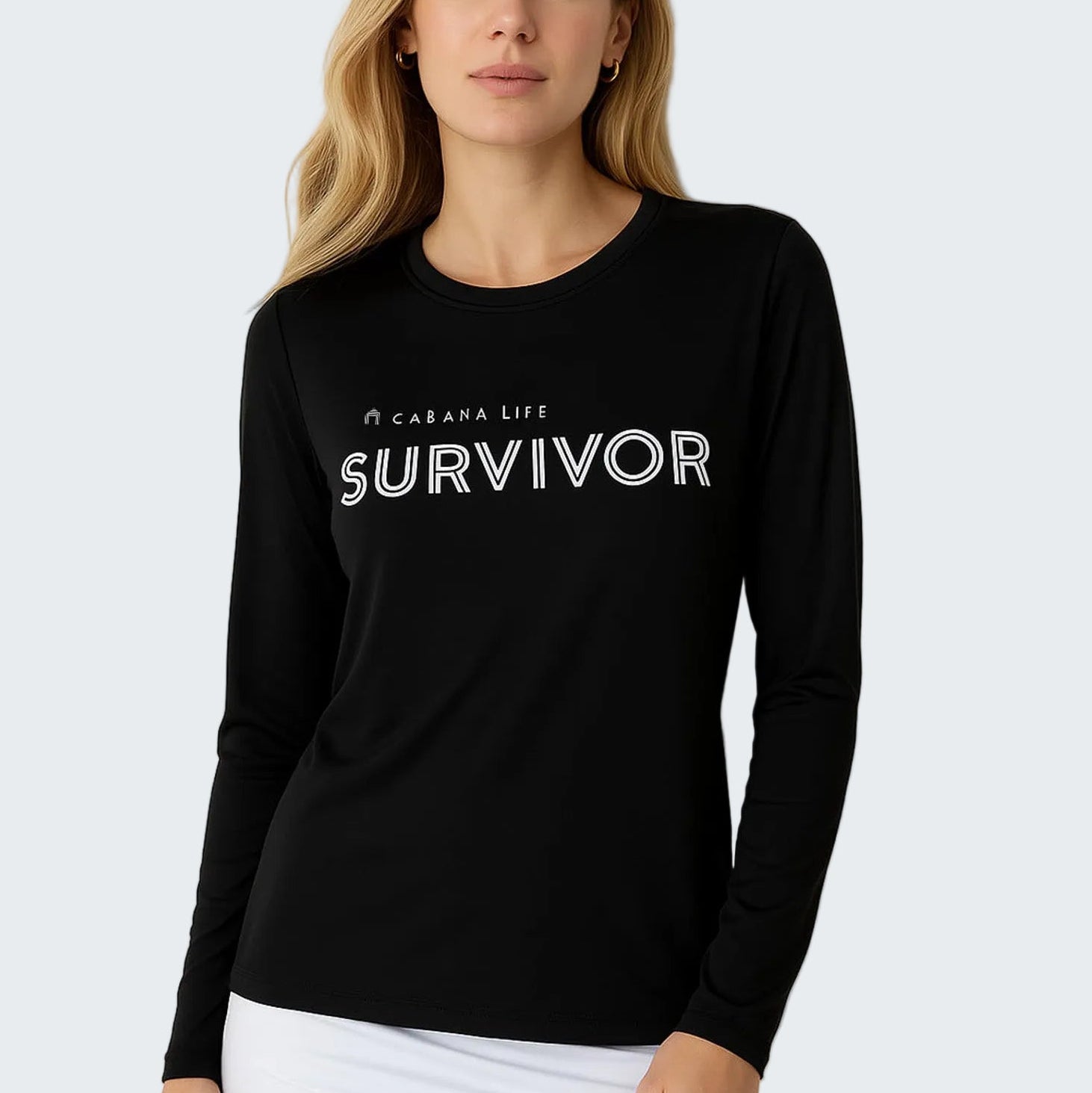 Woman wearing a black long-sleeve shirt with 'SURVIVOR' text on a white background