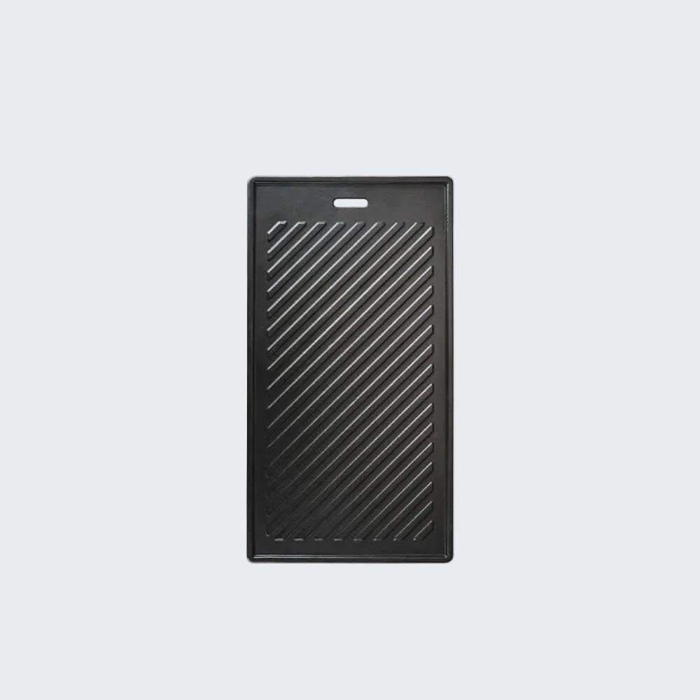 Black rectangular griddle pan on a white background