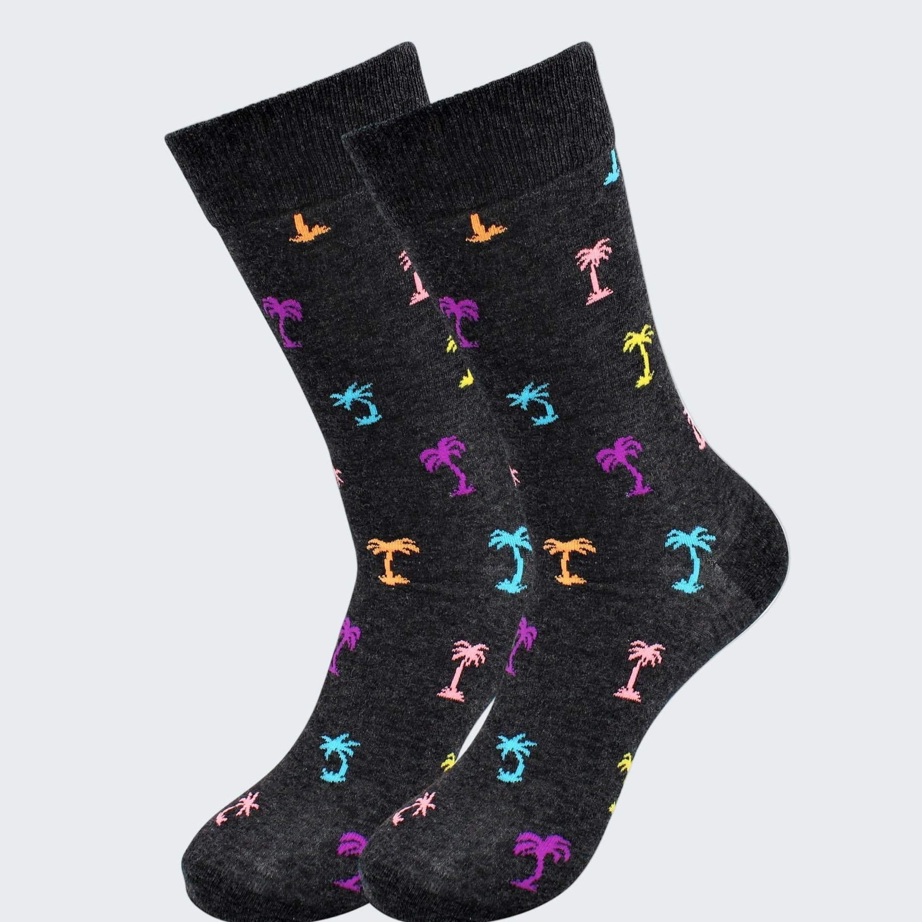Black socks with colorful palm tree pattern on a white background