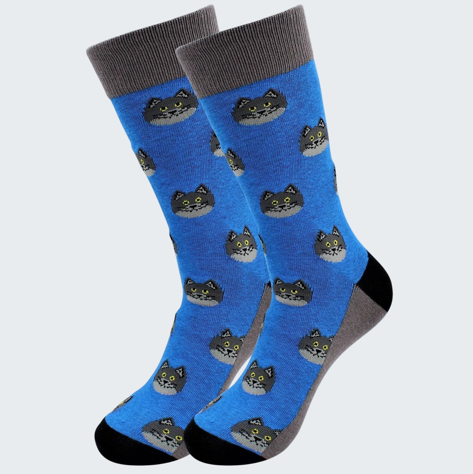 Pair of blue socks with cat pattern on a white background
