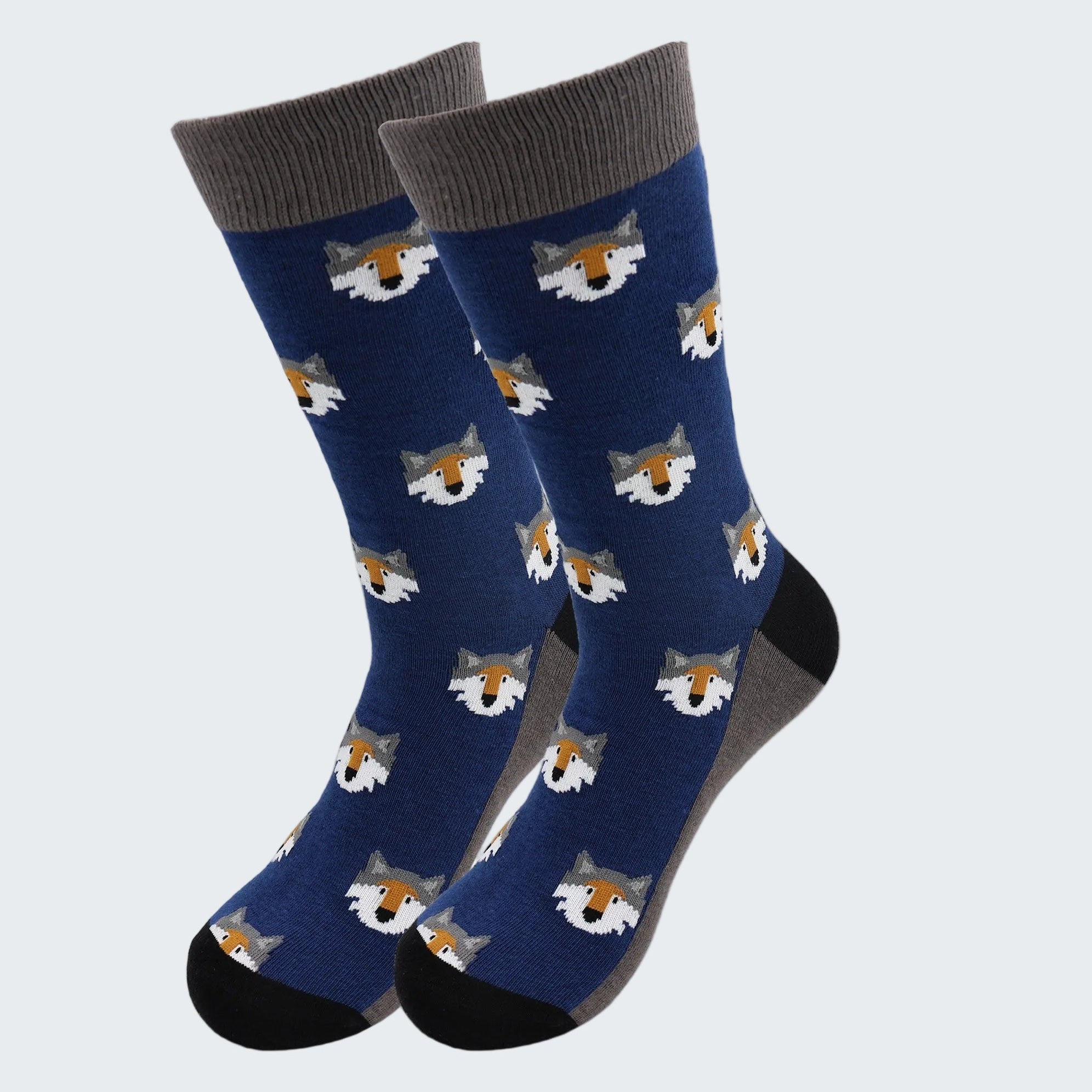 Pair of blue socks with fox pattern on a white background