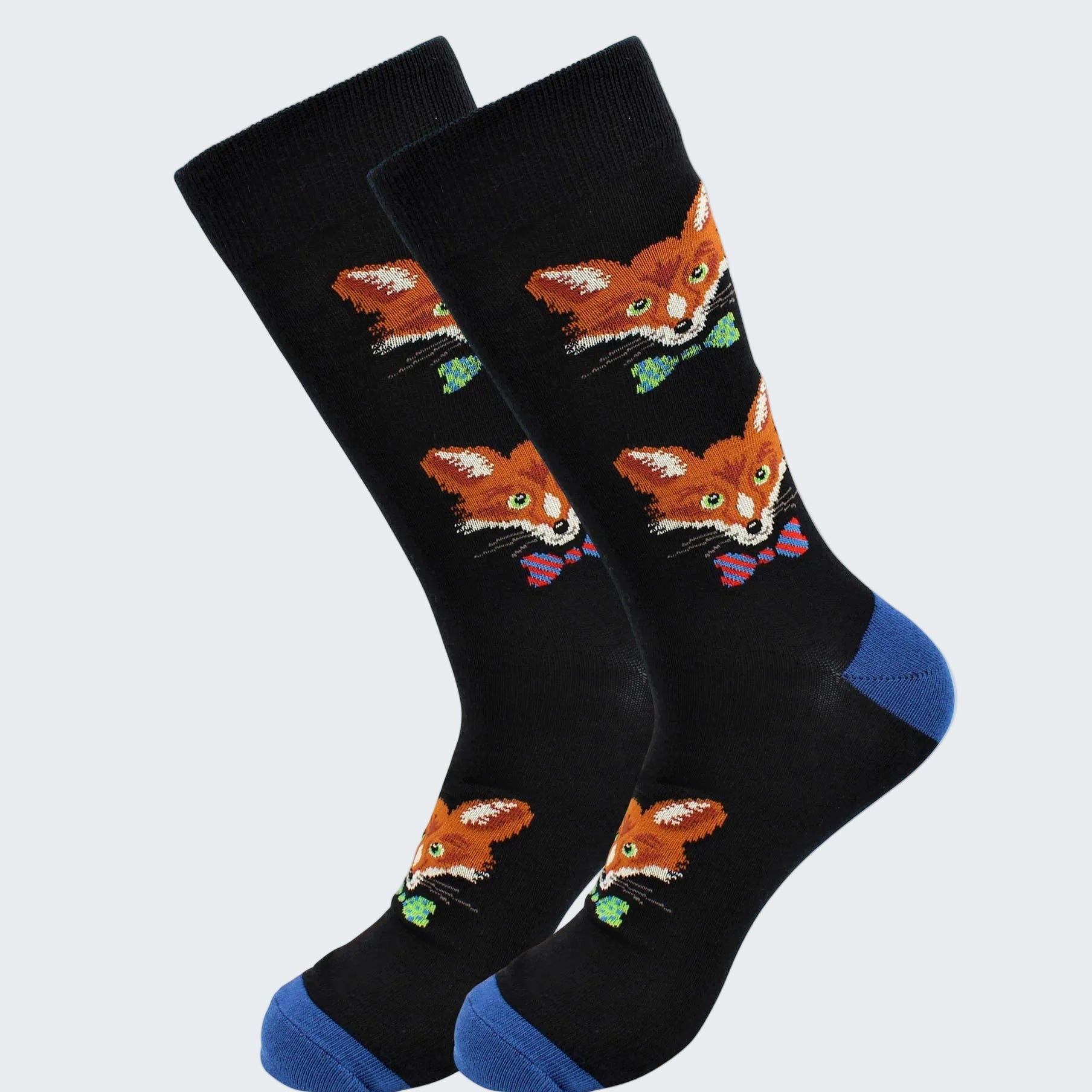 Black socks with fox designs and blue toes on a white background
