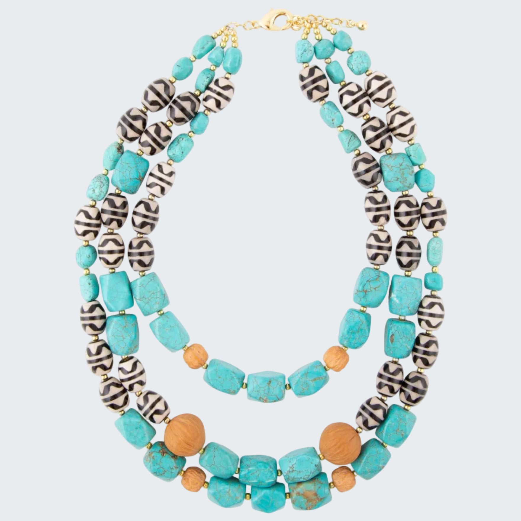 Multicolored beaded necklace with turquoise, black, and brown beads on a white background