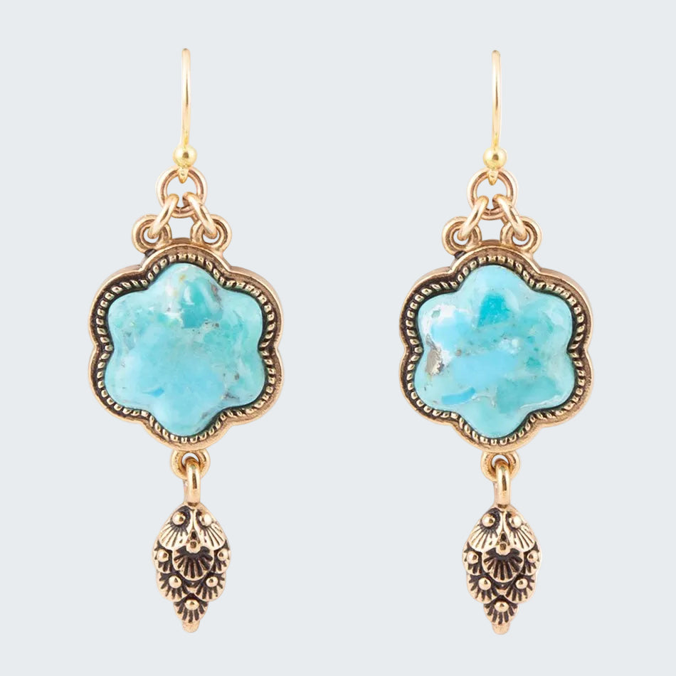 Turquoise stone earrings with gold accents on a white background