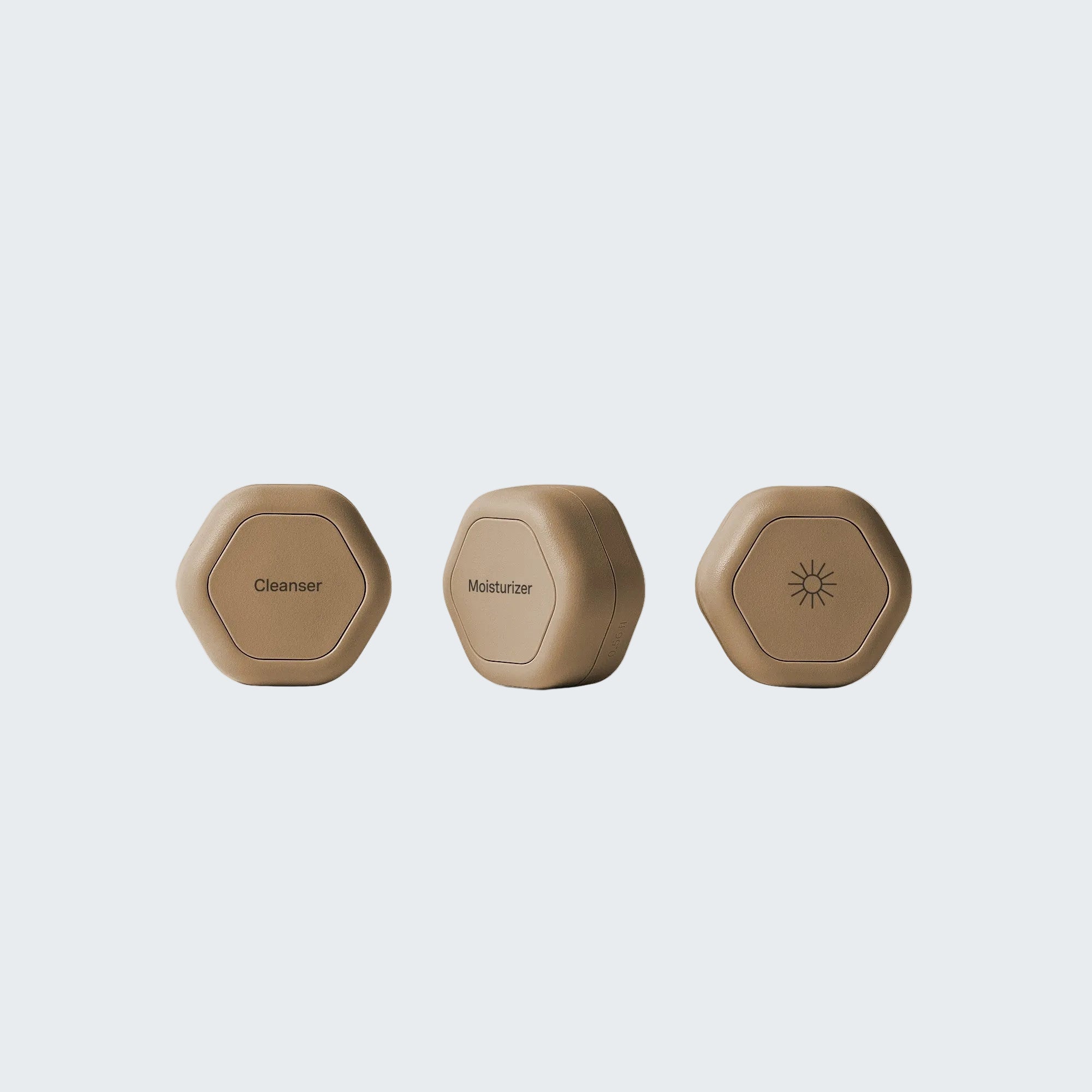 Three beige hexagonal devices labeled 'AM', 'PM', and a circular button on a white background