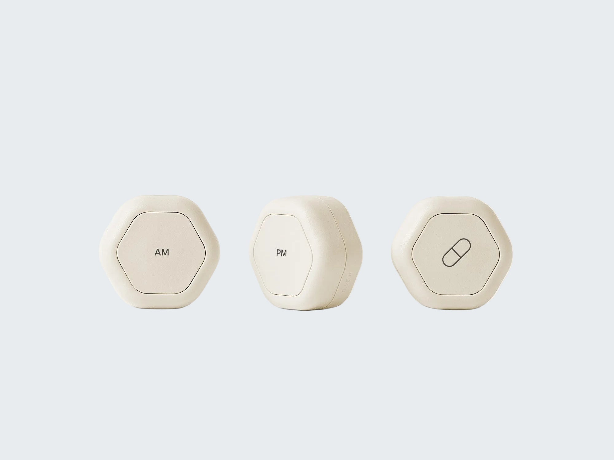 Three white hexagonal containers labeled 'Hair Serum', 'Hair Gel', and 'Lumin' on a white background.